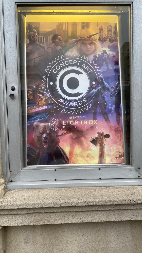 Concept Art Awards poster in display case at Lightbox Expo